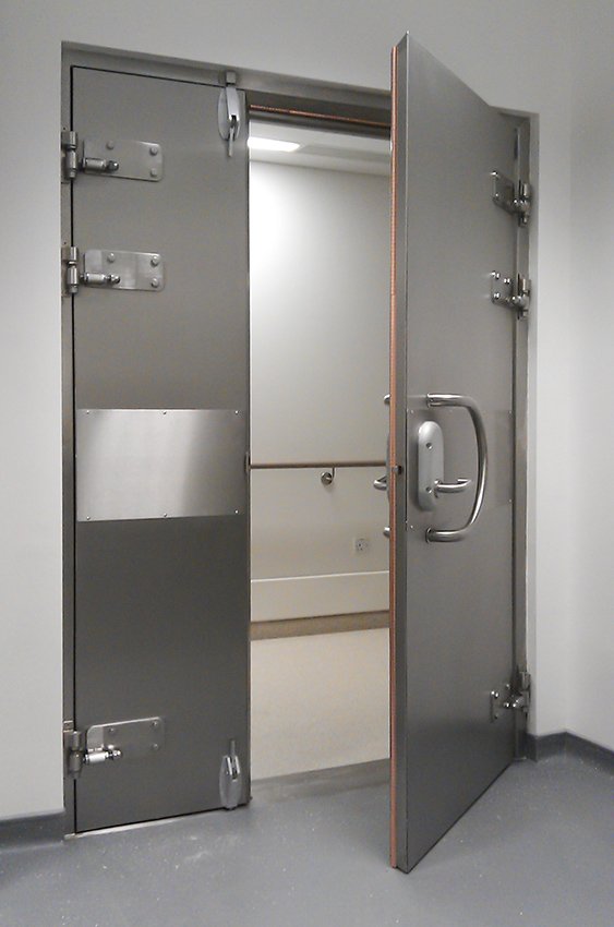 EMP shielded door with contact gasket system for a hardened facility